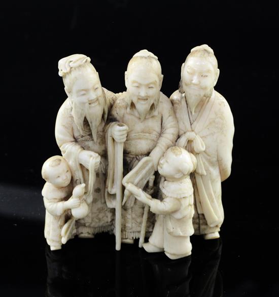 A Japanese ivory okimono of three sages and two attendant children, Meiji period, height 5.9cm